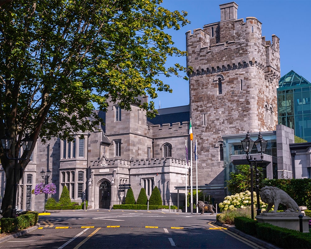 Clontarf Castle Hotel, Dublin — castle exterior and turreted stone façade on a clear day
