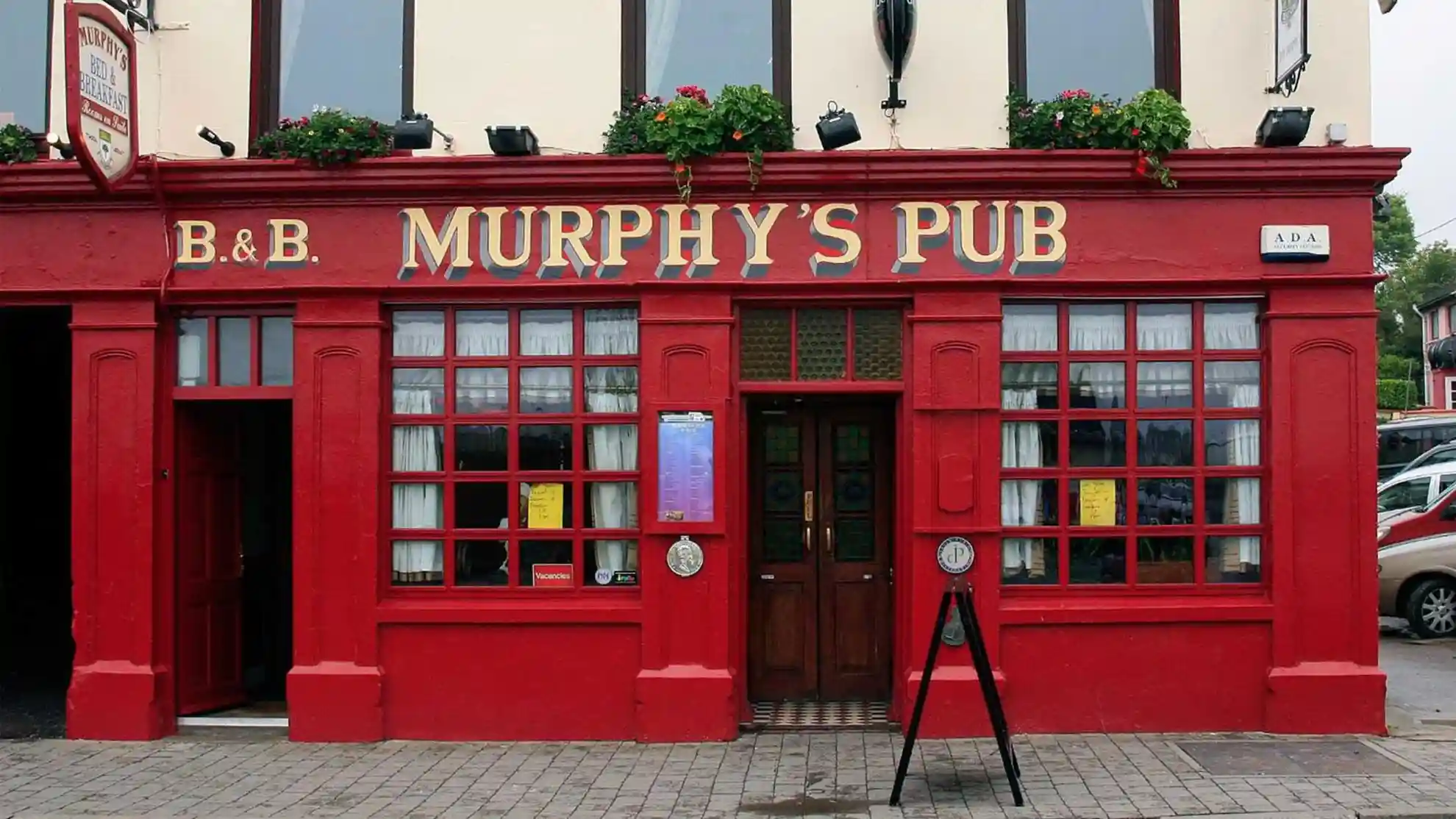 Murphy's Pub Bed & Breakfast, Dingle — red-painted pub frontage on the main street